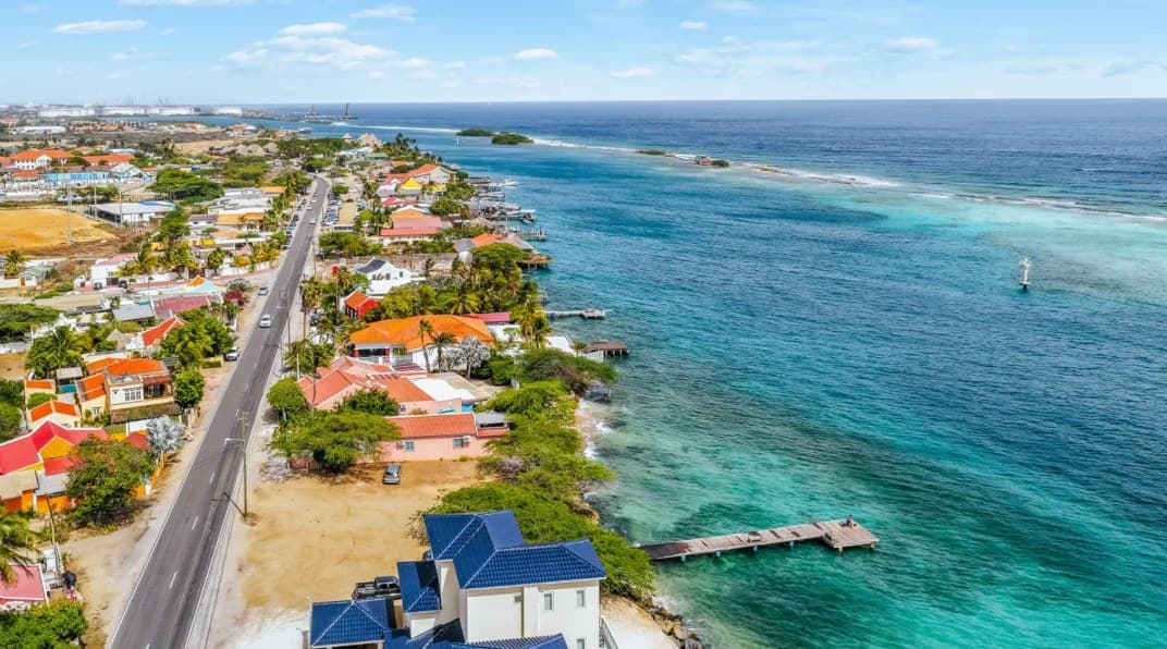 Aerial view of the Savaneta coastline and turquoise water