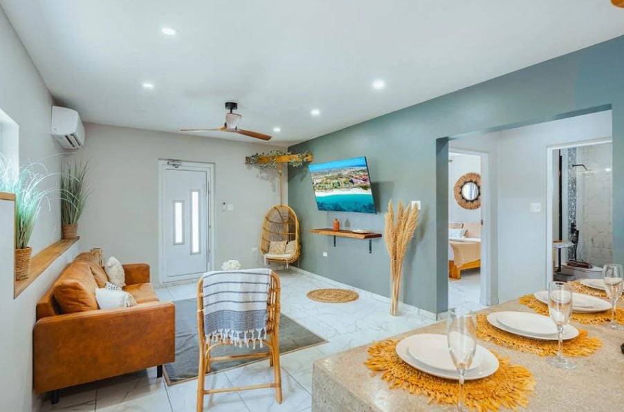 Living and dining area with leather sofa and table set