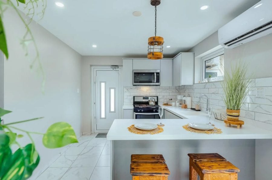 Bright white kitchen with stainless appliances