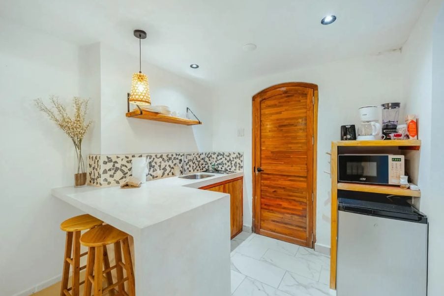 Kitchenette counter with bar stools