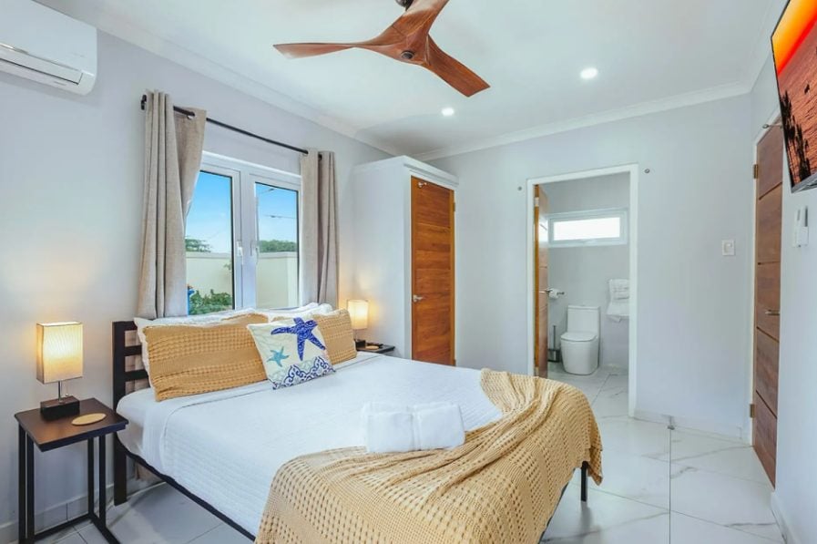 Bedroom with ceiling fan and bedside lamps