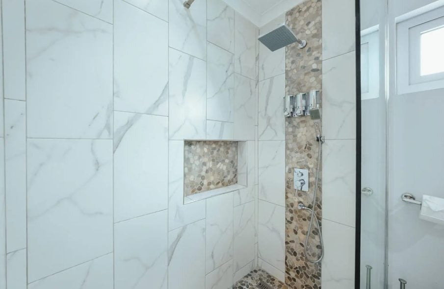 Walk-in shower with marble tiles