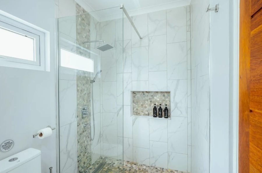 Walk-in shower with marble tiles